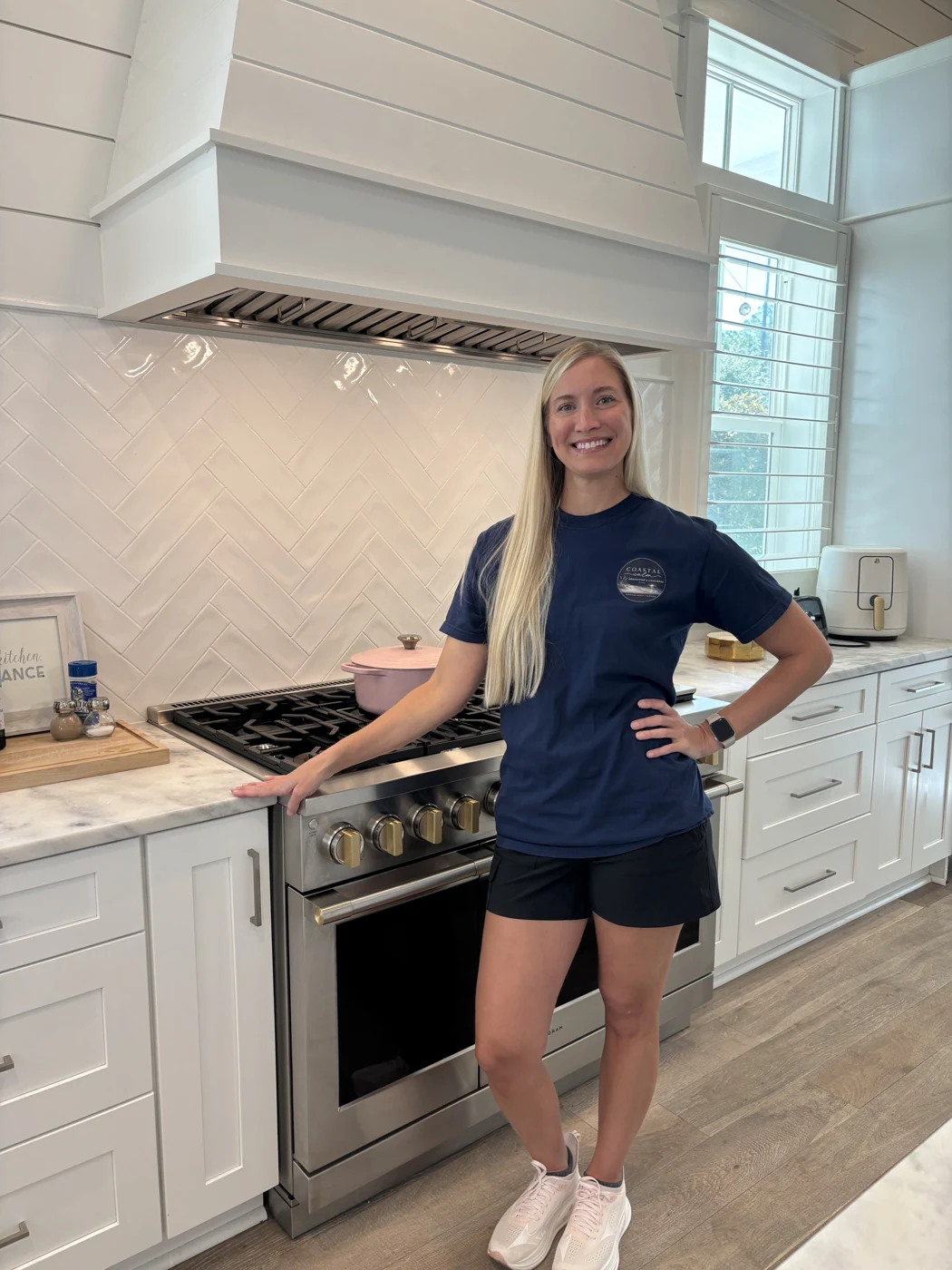 Abbey, founder of Coastal Calm, in a coastal kitchen